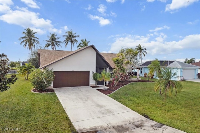 view of front of home with a garage and a front yard