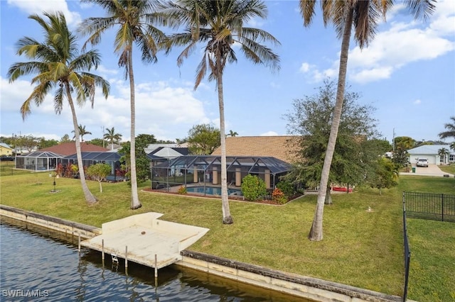 dock area featuring a lawn, glass enclosure, and a water view