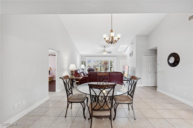 dining space featuring light tile patterned floors, ceiling fan with notable chandelier, and high vaulted ceiling