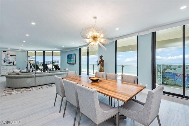 dining room featuring a notable chandelier and floor to ceiling windows