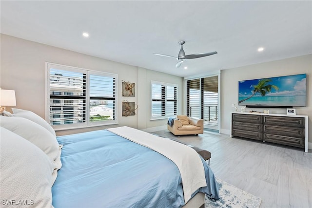 bedroom with ceiling fan and light wood-type flooring