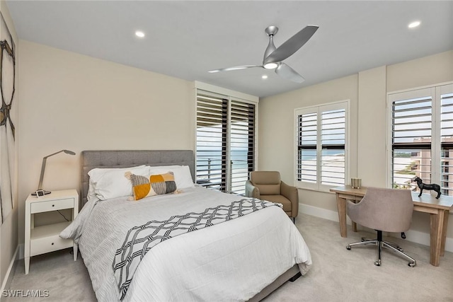 carpeted bedroom with ceiling fan