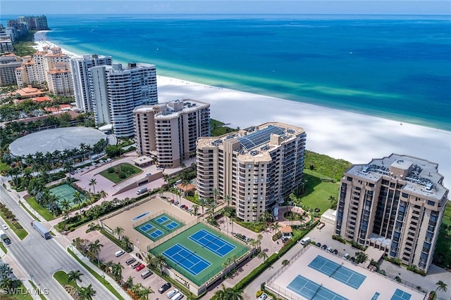 drone / aerial view with a beach view and a water view