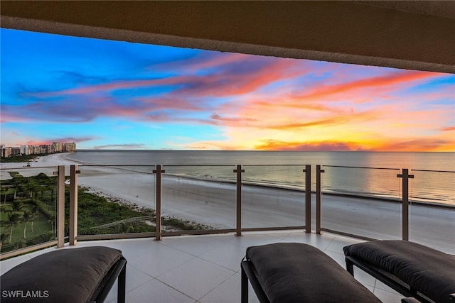 balcony at dusk with a water view