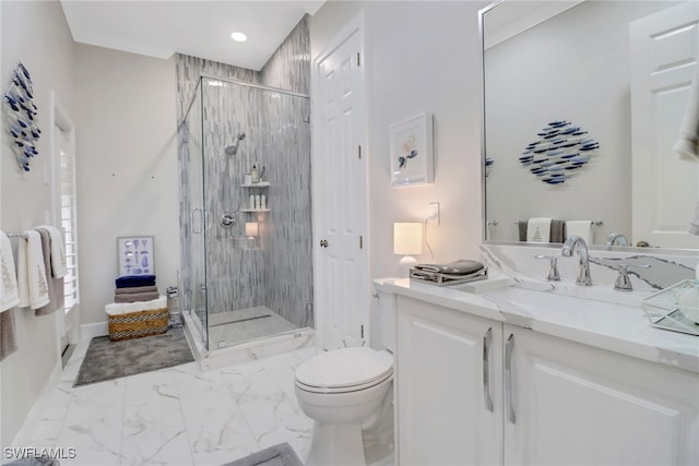 bathroom featuring vanity, an enclosed shower, and toilet