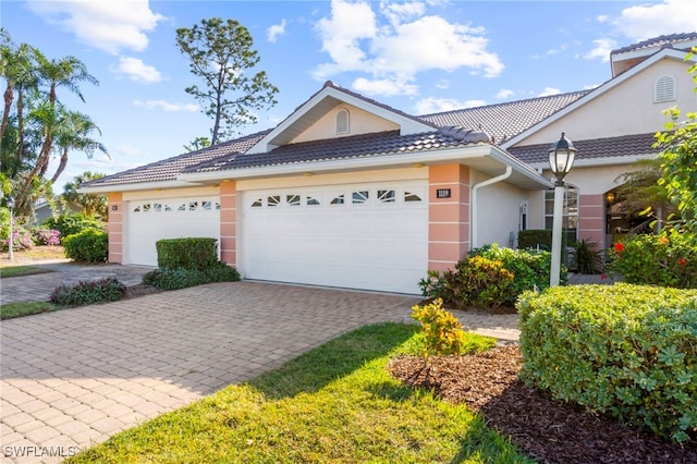 single story home featuring a garage