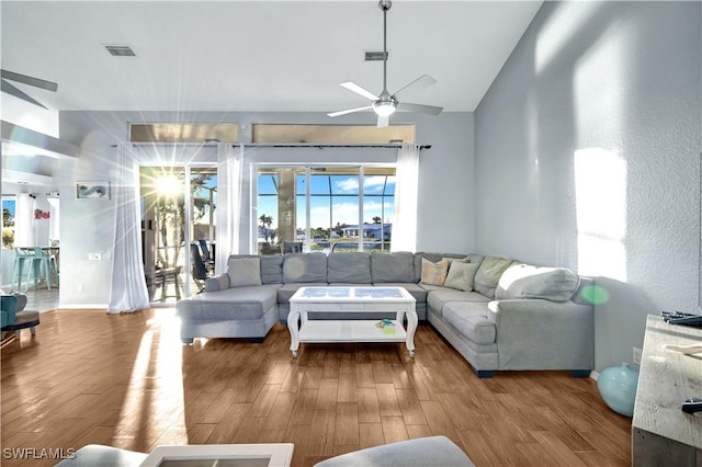 living room with hardwood / wood-style flooring and ceiling fan