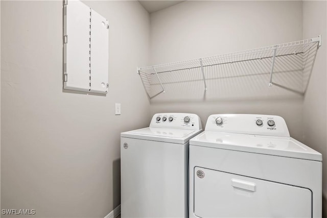 washroom with independent washer and dryer