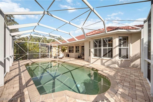 view of pool featuring a patio and a lanai