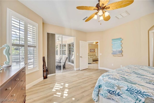 bedroom featuring multiple windows, light hardwood / wood-style flooring, and ceiling fan