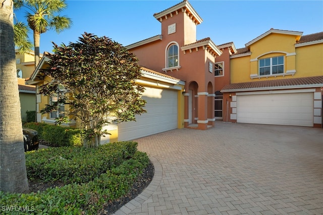 mediterranean / spanish-style home featuring a garage