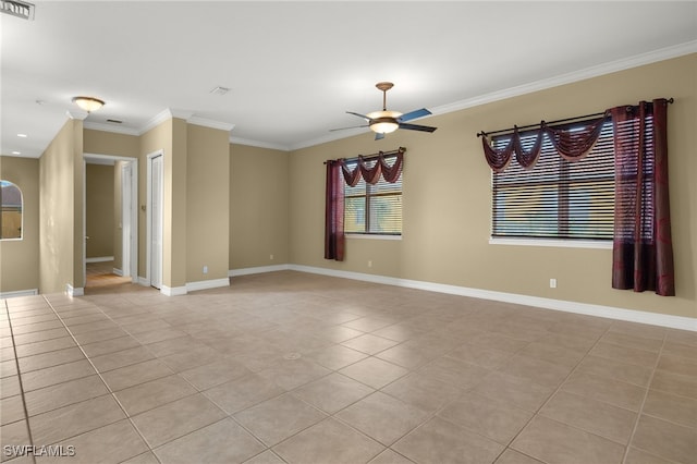 unfurnished room with ceiling fan, light tile patterned floors, and crown molding