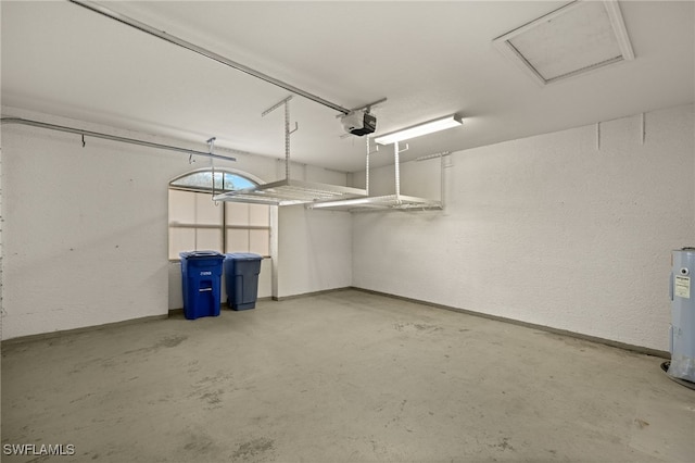 garage with electric water heater and a garage door opener