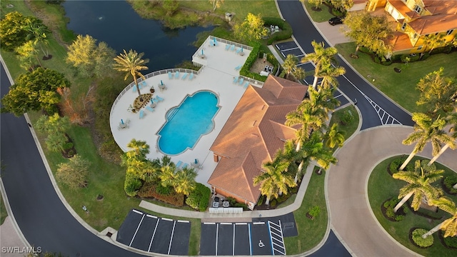 birds eye view of property with a water view