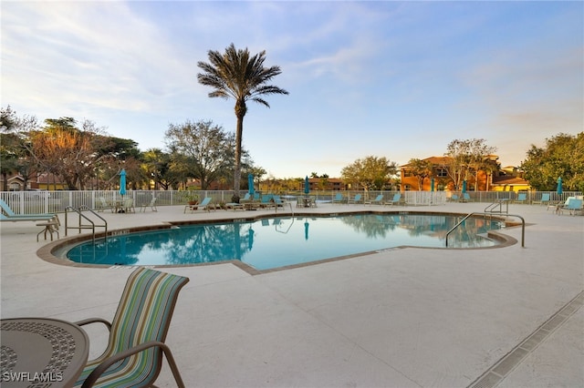 view of swimming pool featuring a patio area