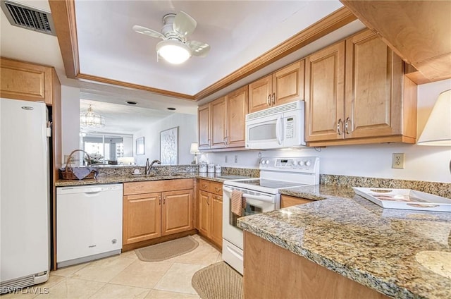 kitchen featuring ceiling fan with notable chandelier, white appliances, sink, light stone counters, and light tile patterned floors