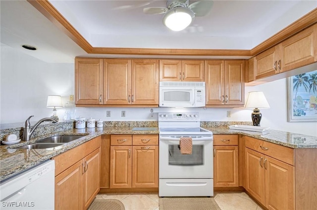 kitchen featuring light tile patterned floors, light stone countertops, sink, and white appliances