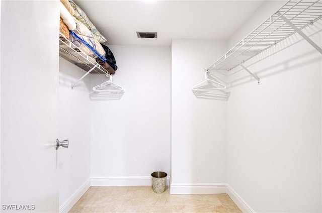 walk in closet featuring tile patterned floors