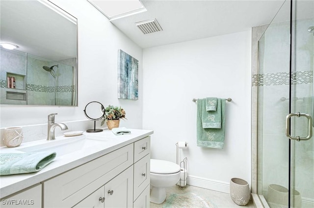 bathroom with toilet, vanity, tile patterned flooring, and an enclosed shower