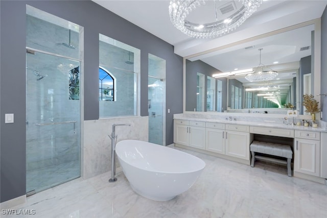 bathroom featuring vanity, independent shower and bath, tile walls, and an inviting chandelier