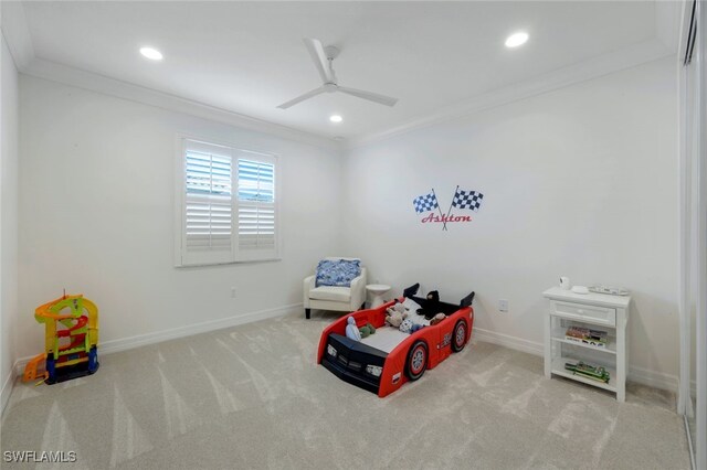 bedroom with ceiling fan, crown molding, and light carpet