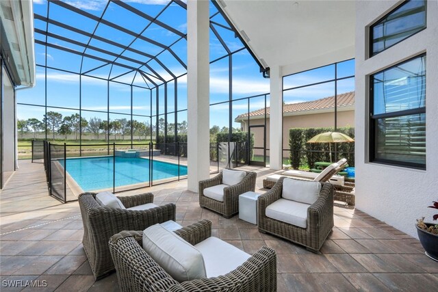 view of swimming pool featuring an outdoor living space, a patio, and glass enclosure