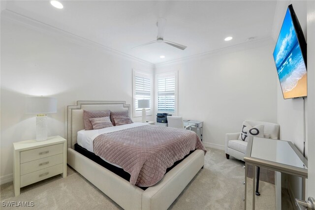 carpeted bedroom with ceiling fan and crown molding