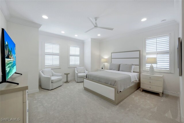 carpeted bedroom with multiple windows, ceiling fan, and crown molding