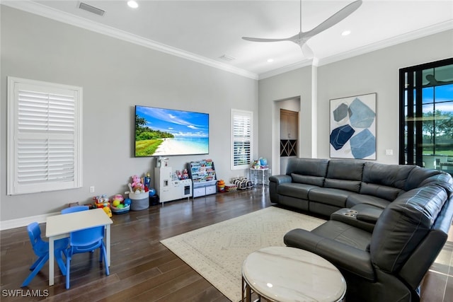 living room featuring dark hardwood / wood-style flooring, ceiling fan, and crown molding