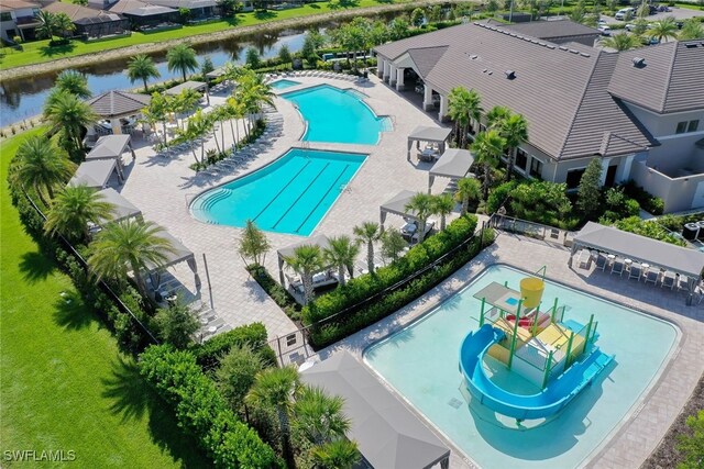 view of swimming pool featuring a water view