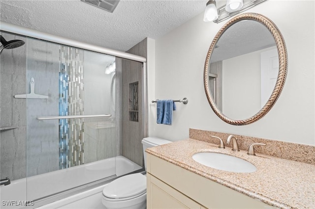 full bathroom featuring vanity, toilet, enclosed tub / shower combo, and a textured ceiling