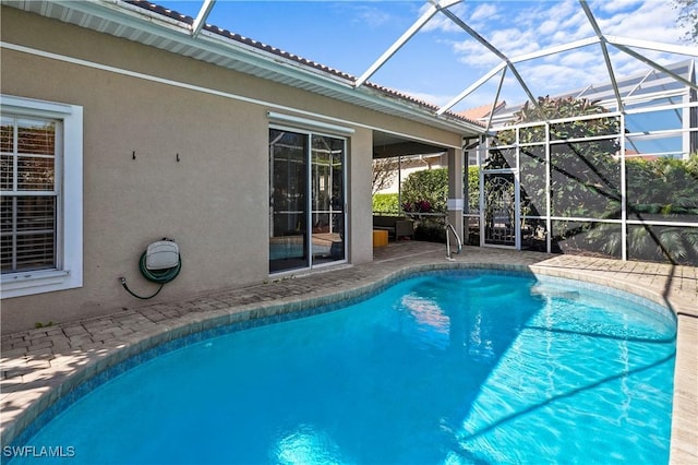 outdoor pool featuring a lanai and a patio