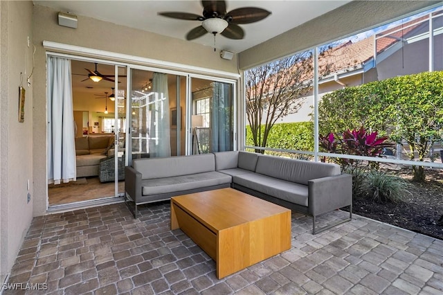 exterior space featuring a ceiling fan and an outdoor living space