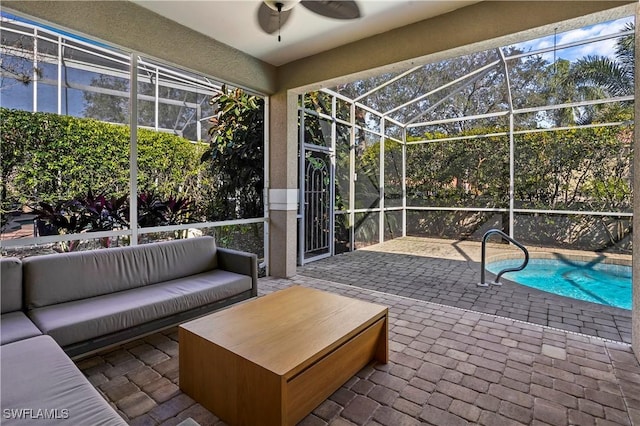 sunroom with ceiling fan and outdoor lounge area