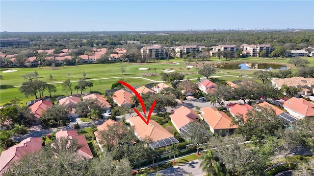 birds eye view of property featuring a water view, a residential view, and golf course view