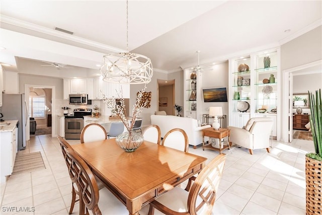 dining space with light tile patterned floors, ceiling fan with notable chandelier, and crown molding