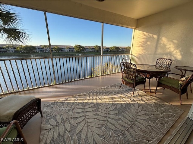 sunroom with a water view