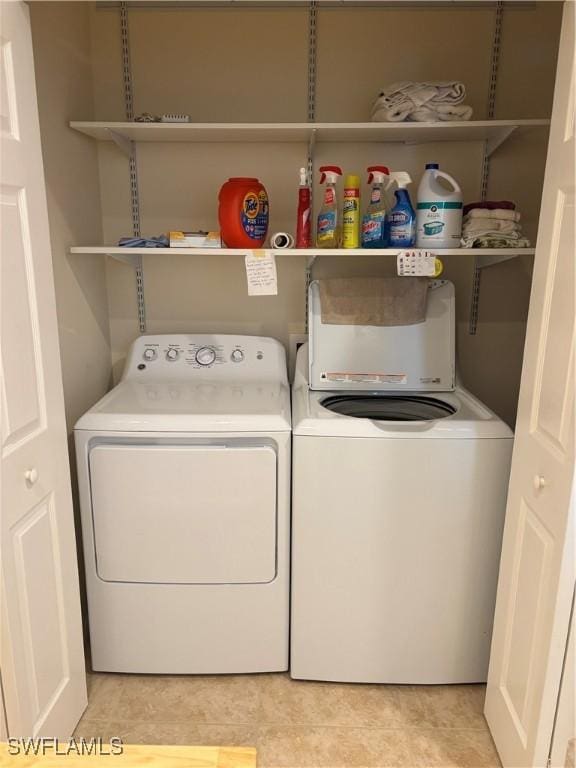 clothes washing area featuring washer and dryer