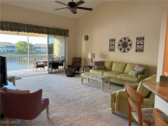 carpeted living room with ceiling fan