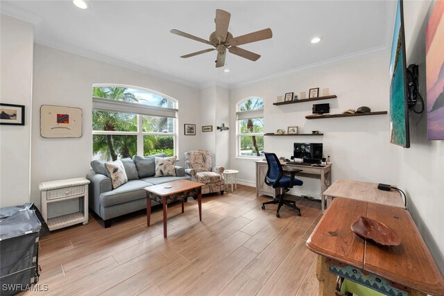 office space with ceiling fan, light wood-type flooring, and ornamental molding