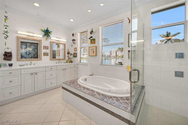 bathroom featuring shower with separate bathtub, vanity, tile patterned floors, and crown molding