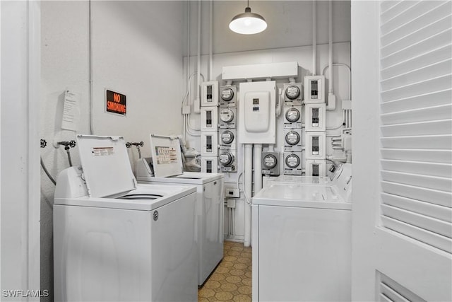 clothes washing area with stacked washer / dryer and washer and dryer