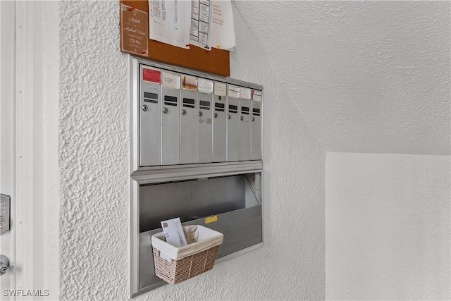 mudroom featuring mail boxes and vaulted ceiling