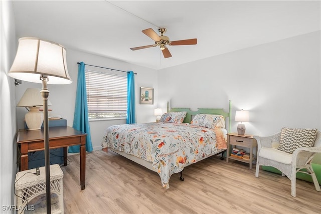 bedroom featuring light hardwood / wood-style flooring and ceiling fan