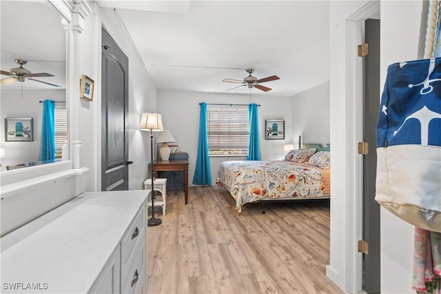 bedroom featuring ceiling fan and light hardwood / wood-style floors