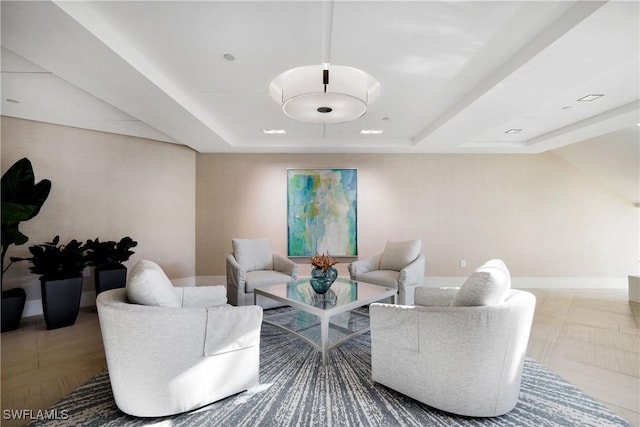 living room with a tray ceiling