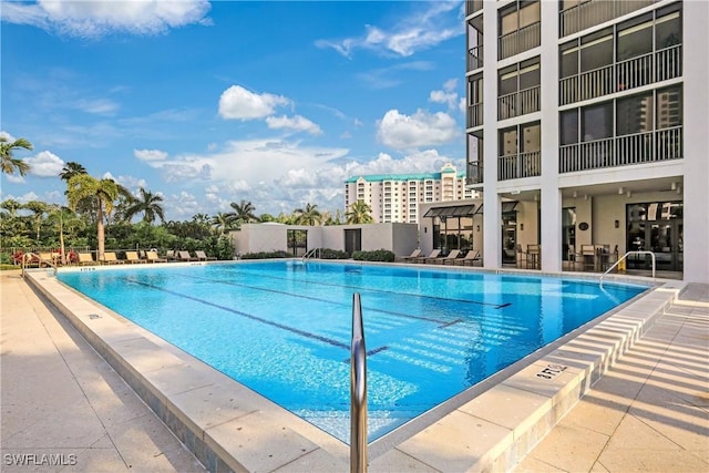 view of swimming pool featuring a patio area