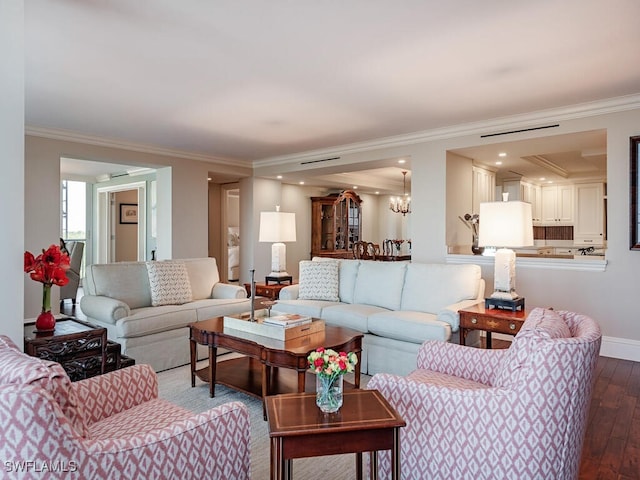 living room featuring crown molding and hardwood / wood-style flooring