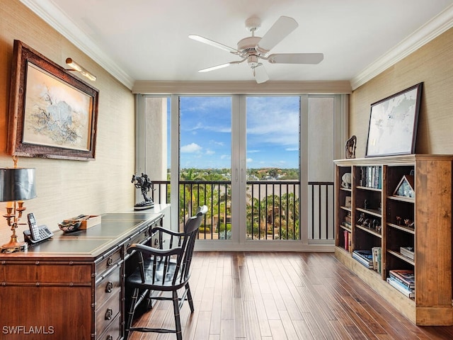 office space featuring ceiling fan, expansive windows, dark hardwood / wood-style flooring, and crown molding