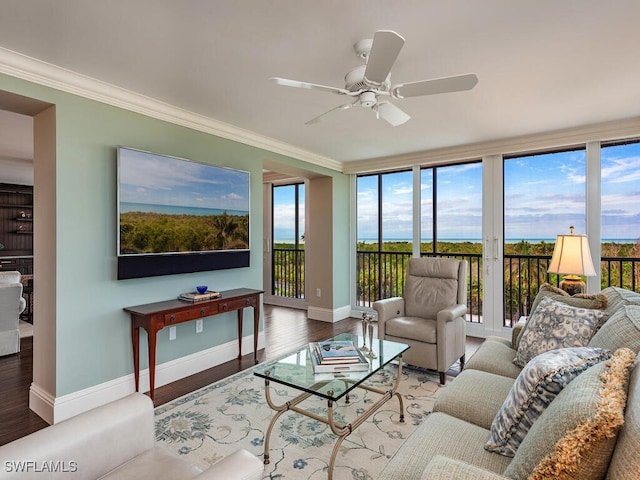 living room featuring hardwood / wood-style flooring, ceiling fan, crown molding, and french doors